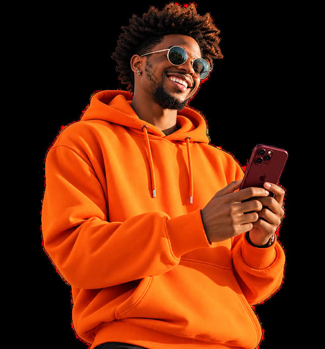 Smiling man in an orange hoodie checking the RunTango app on his phone